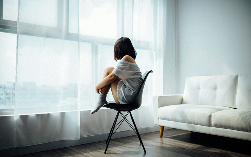 sitting alone trying CBT therapy in New Haven, CT